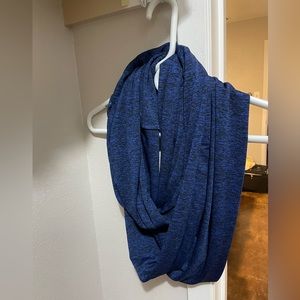 Travel scarf with storage pocket
